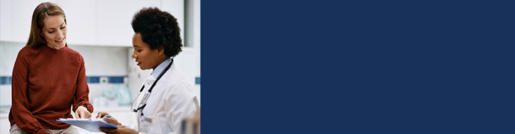 Field of bright orange poppies and wildflowers under a clear blue sky.